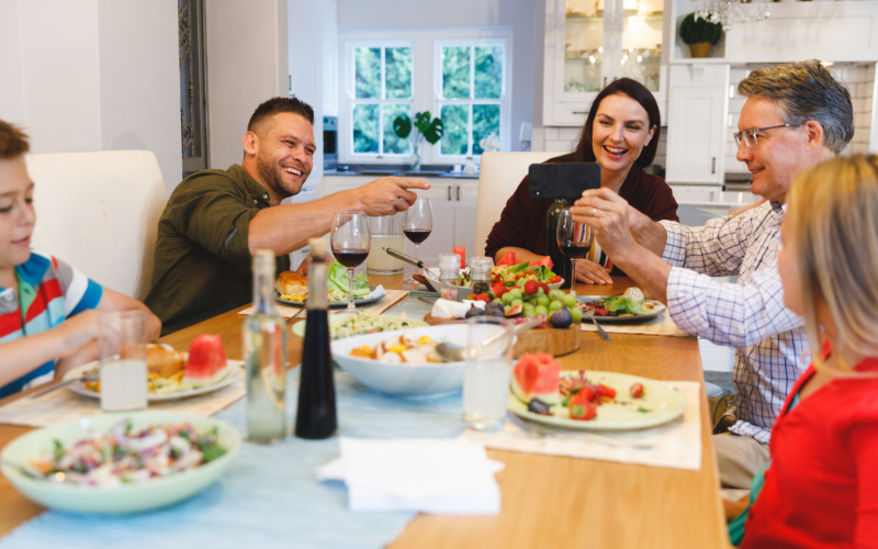 Family seated around a table having dinner